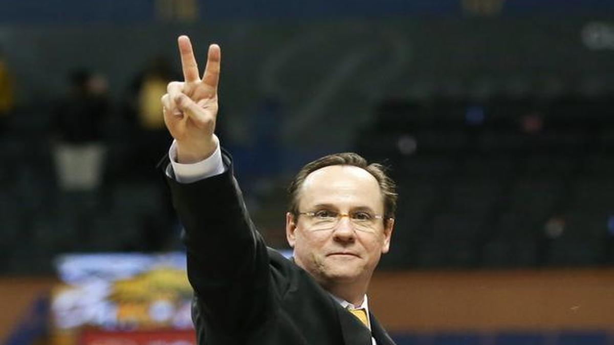 Gregg Marshall acknowledges the crowd after cutting down the net after his team won the Missouri Valley Conference Tournament last month in St. Louis.