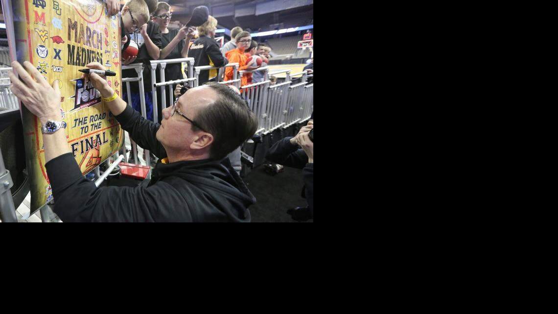 
Wichita State coach Gregg Marshall signs autographs for fans after the Shocker's open practice at the CenturyLink Center in Omaha on March 20.
