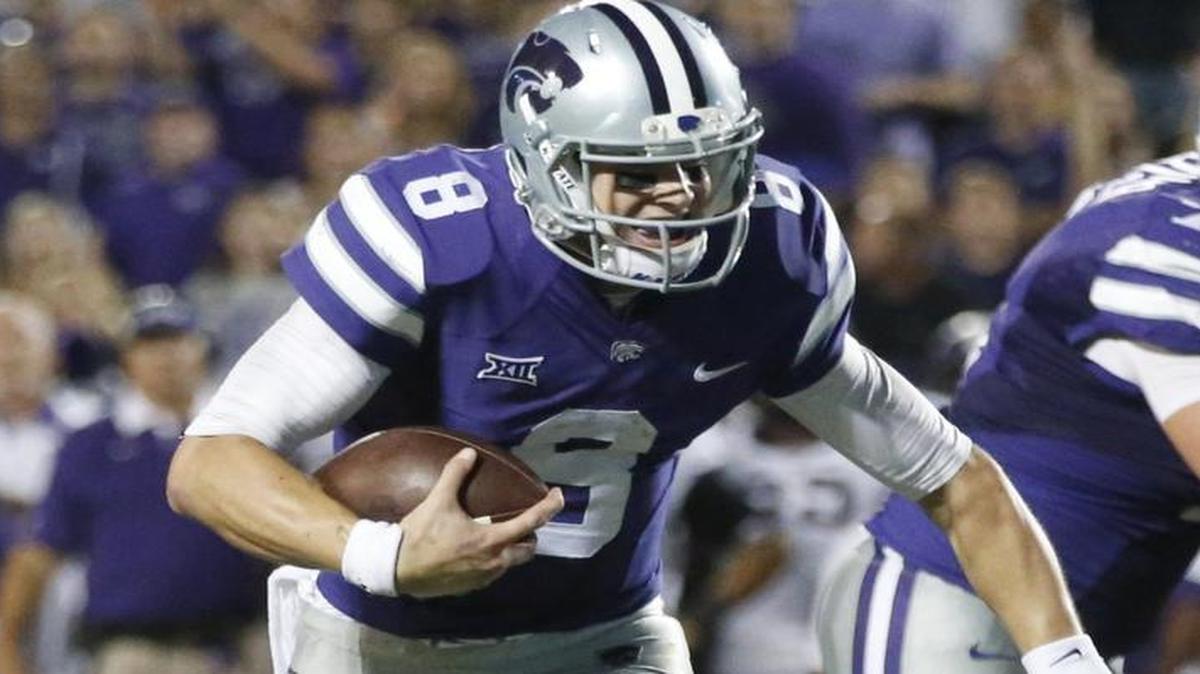 
K-State quarterback Joe Hubener drags a TCU defender as he grinds his way to the end zone Saturday in Manhattan. 
