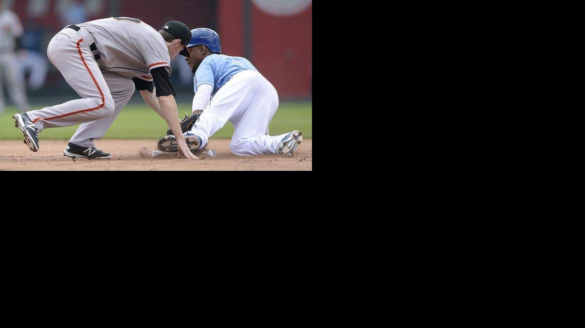 
Jarrod Dyson, right, was part of Kansas City’s seven stolen-base effort in a 7-4 win over San Francisco on Sunday at Kauffman Stadium.

