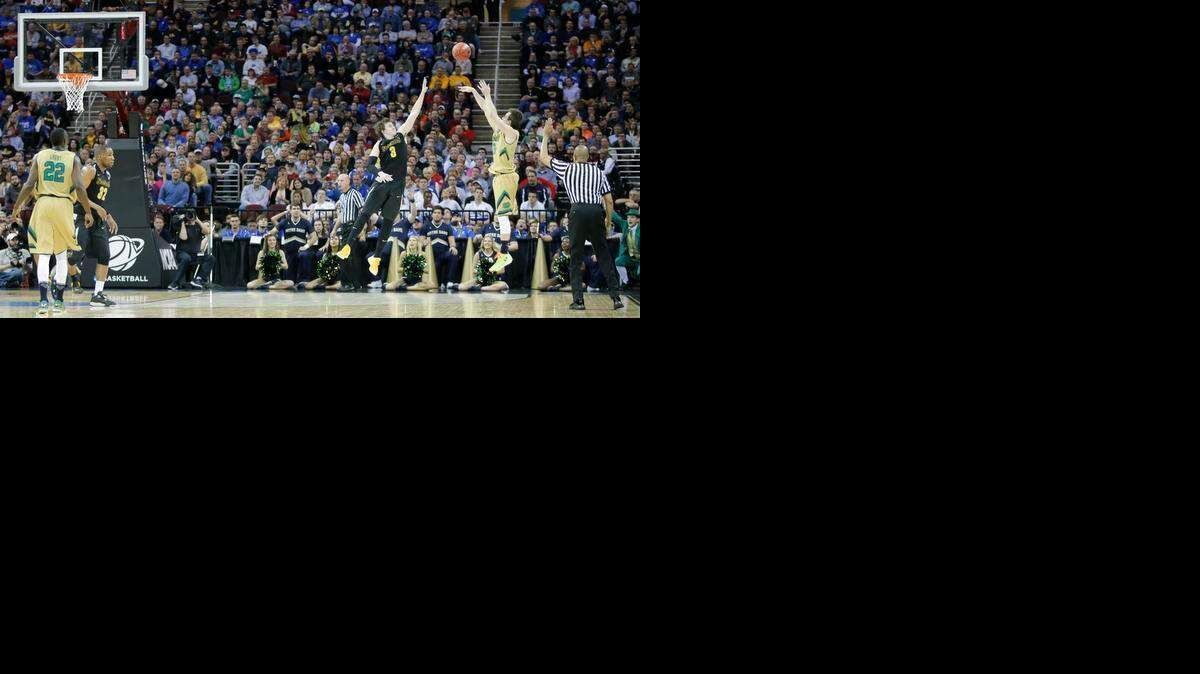 
Notre Dame guard Pat Connaughton hits a three-pointer that sealed Wichita State's fate in the Midwest Regional semifinal at Quicken Loans Arena in Cleveland on Thursday.
