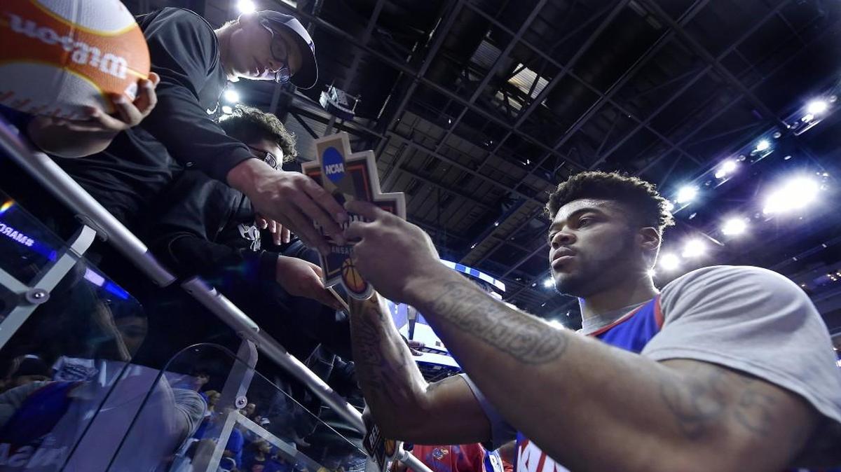 Frank Mason signs autographs after the Jayhawks’ practice Wednesday afternoon at the Sprint Center.