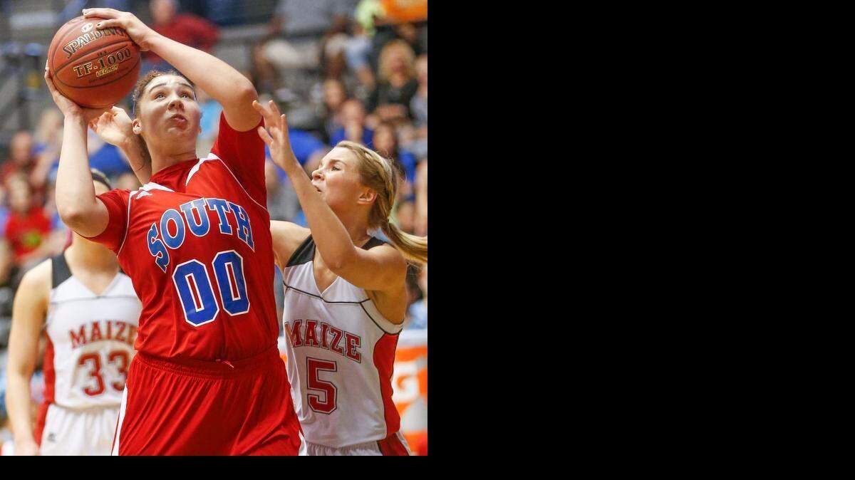 
South’s Kendrian Elliott shoots in front of Maize’s Keiryn Swenson in the second quarter Saturday at Koch Arena.
