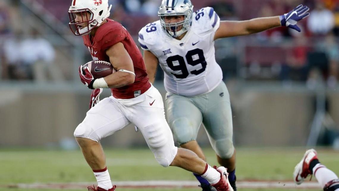 Kansas State defensive tackle Trey Dishon (99) tries to catch Stanford running back Christian McCaffrey during the Sept. 2 opener in Palo Alto, Calif.
