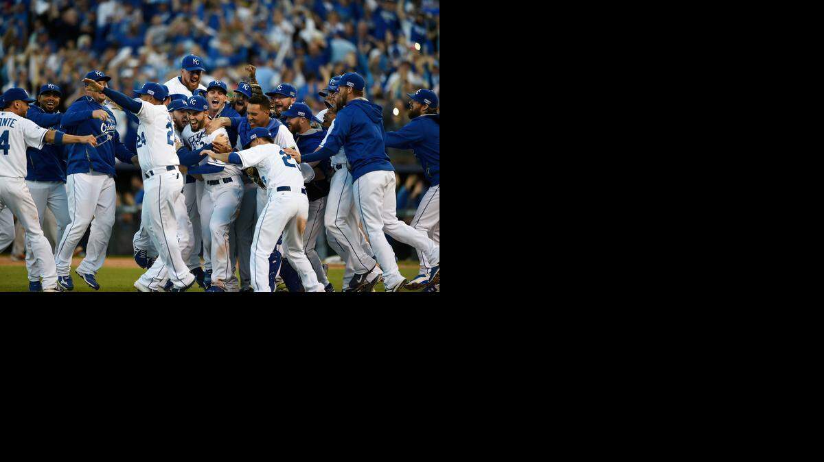 The Kansas City Royals rush the field to celebrate after the final out in a series-clinching 2-1 win against the Baltimore Orioles in Game 4 of the American League Championship Series on Oct. 15 in Kansas City, Mo.