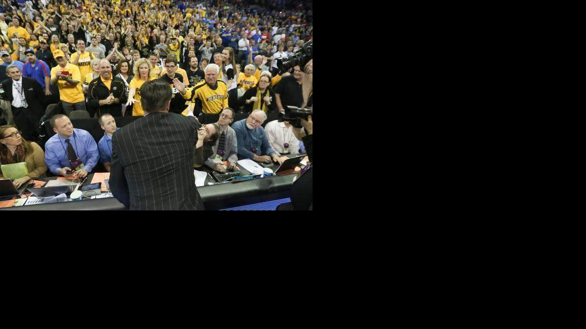 
Wichita State coach Gregg Marshall celebrates with his family and fans after the Shockers defeated Kansas 78-65 on Sunday in Omaha.
