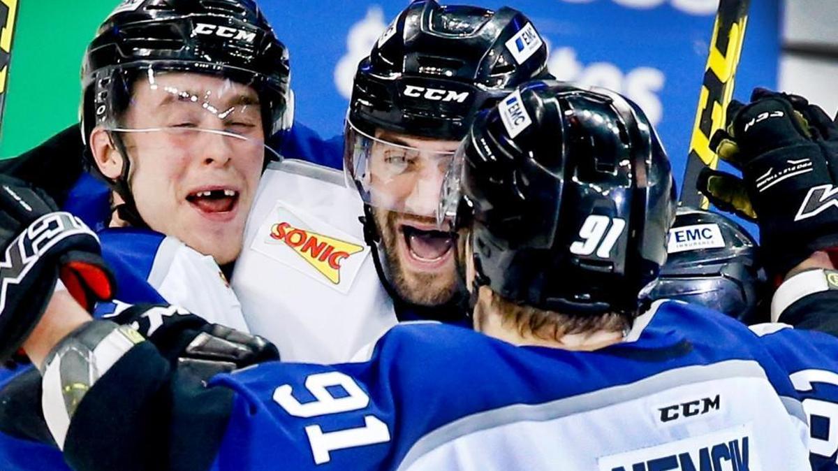 The Thunder's Brandon Martell, center, gets congratulated by teammates Logan Nelson, left, and Martin Nemcik (91) after scoring in the second period at Intrust Bank Arena on Dec. 30.