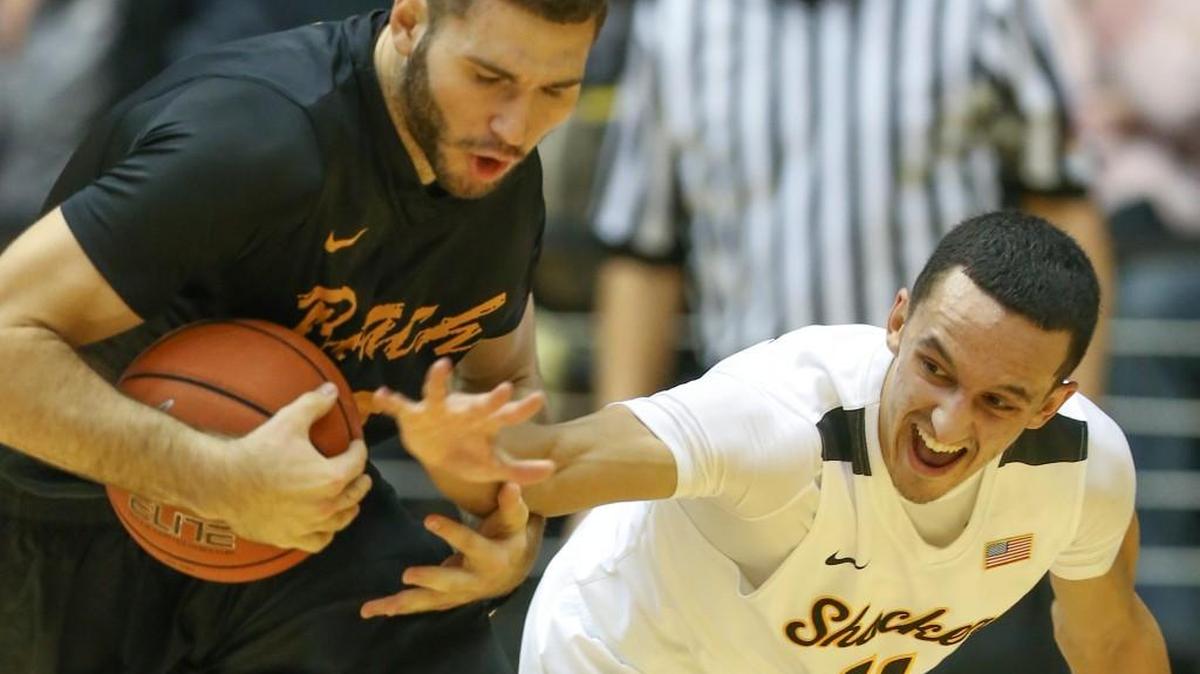 Wichita State guard Landry Shamet tries to strip the ball from Long Beach State forward Gabe Levin. Shamet is showing early signs of being a lock-down Shocker defender.