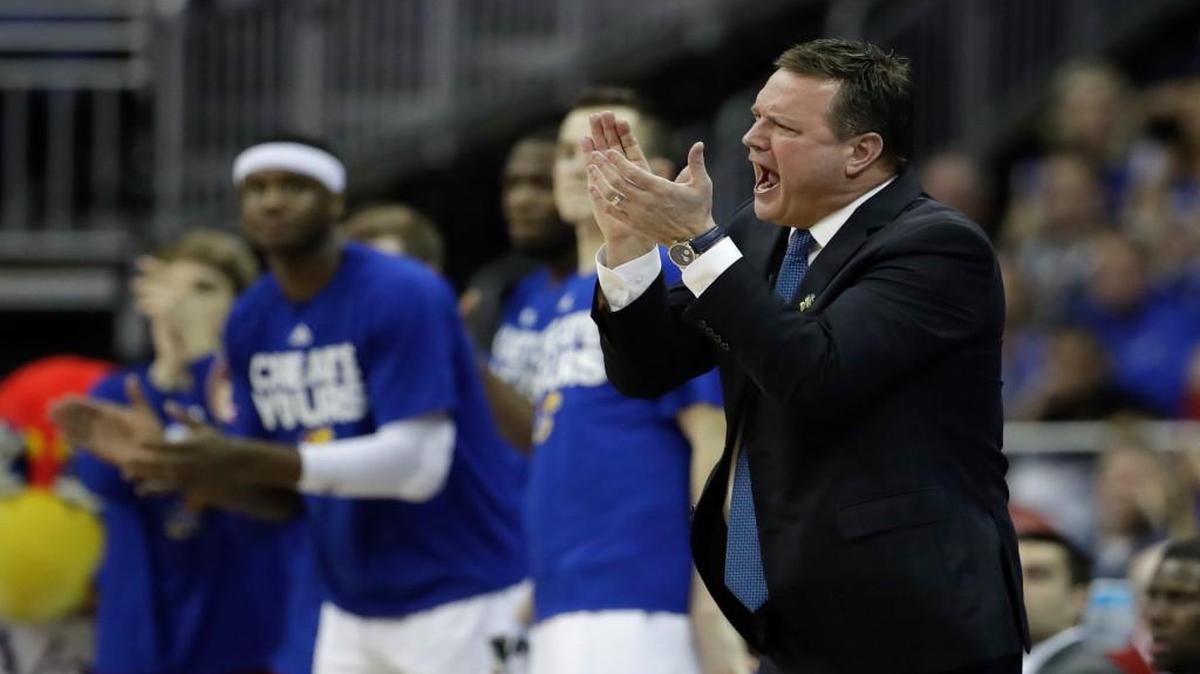 Kansas coach Bill Self applauds his team during the first half of the regional semifinal against Purdue on Thursday in Kansas City, Mo.