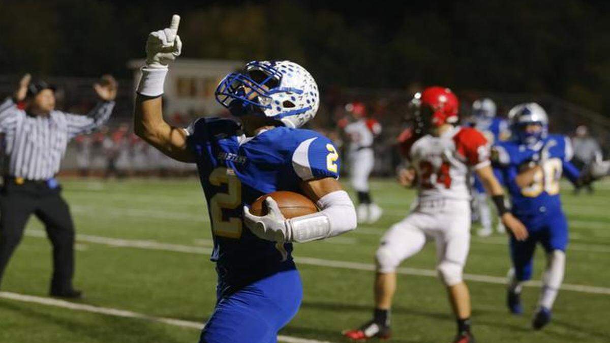 
Collegiate's Jacques Williams celebrates a touchdown in the first half of the game against Conway Springs in the first round of Class 3A playoffs. 
