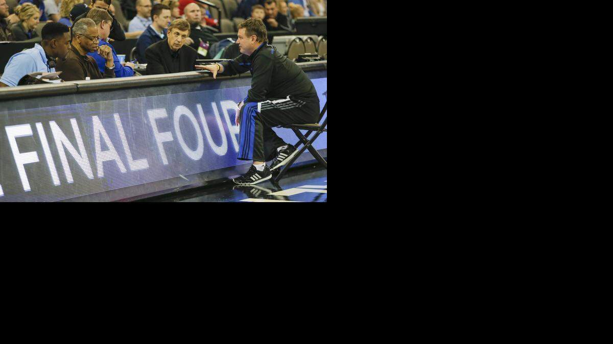 
Kansas coach Bill Self, right, talks with the CBS broadcast team of Chris Webber, left, Len Elmore and Marv Albert during KU’s workout Thusday at the CenturyLink Center.
