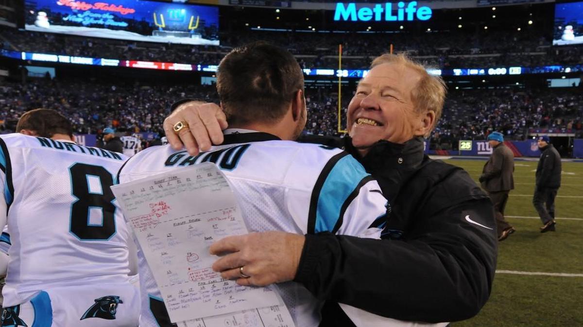 Panthers special-teams coach Bruce DeHaven, right, hugs kicker Graham Gano after Gano’s game-winning field goal to beat the Giants on Dec. 20.