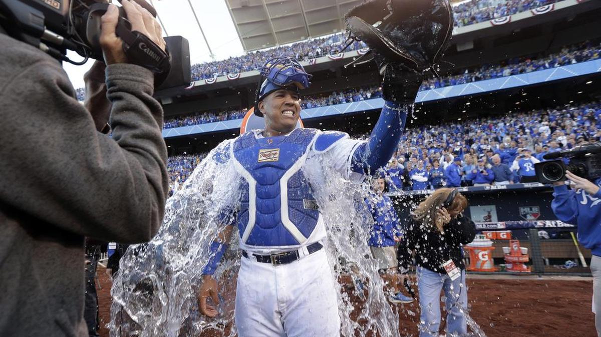 
Royals catcher Salvador Perez gets water dumped on him by a teammate after their 5-4 victory over the Houston Astros in Game 2 on Friday.
