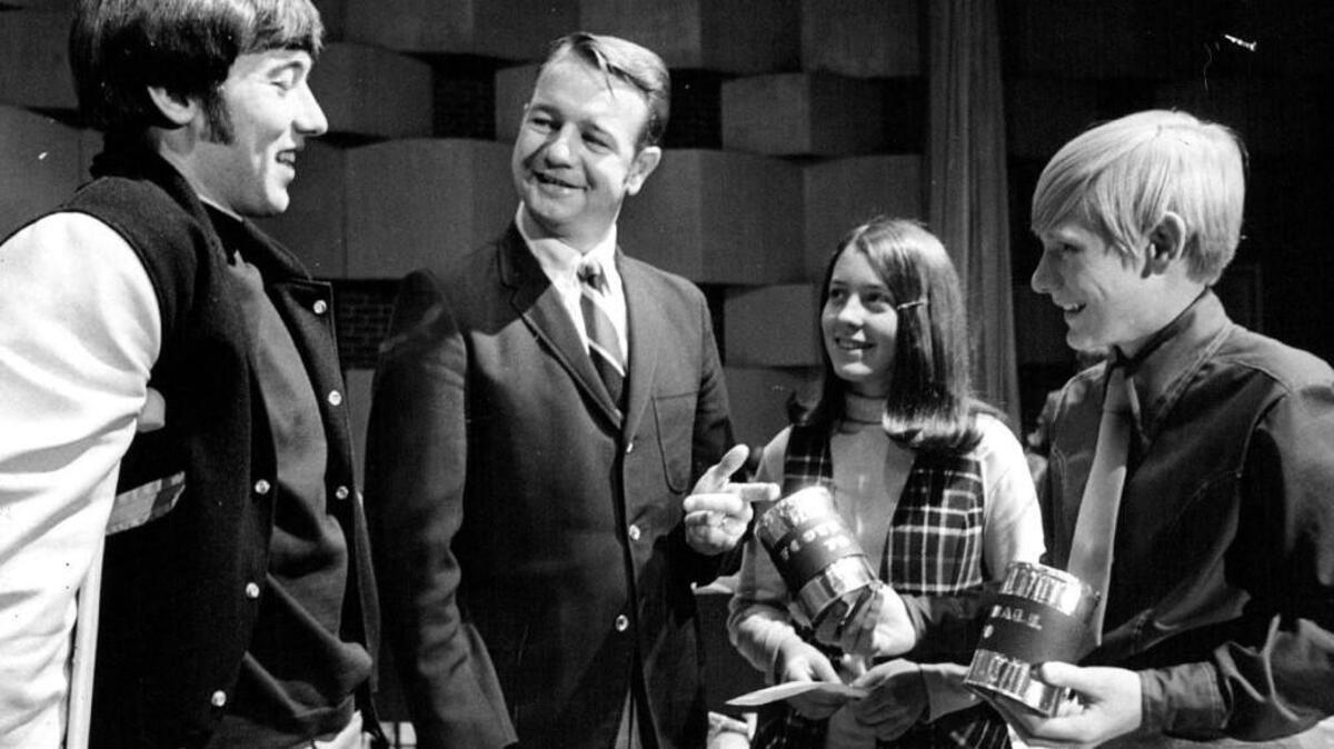 
Injured Wichita State football player Bob Renner, left, and coach Bob Seaman accept donations from Coleman Junior High students after the Oct. 2, 1970 plane crash that killed 31 people in Colorado. 
