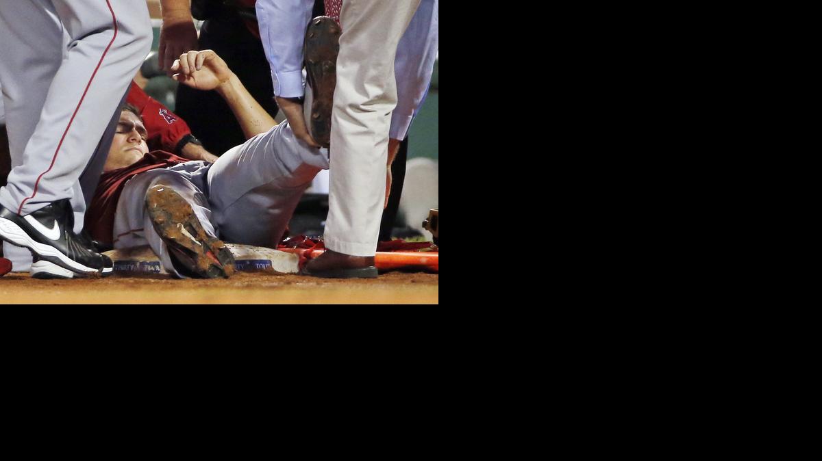 
Los Angeles Angels starting pitcher Garrett Richards is lifted onto a stretcher after an injury during the second inning of a baseball game against the Boston Red Sox at Fenway Park in Boston, Wednesday, Aug. 20, 2014. 
