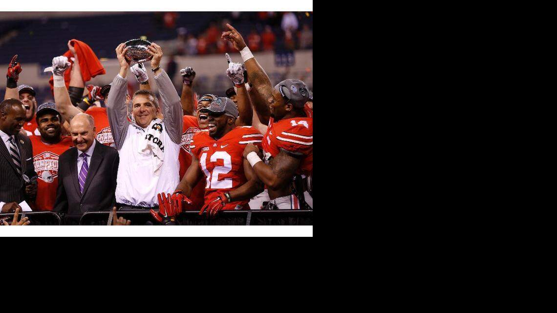 
Ohio State coach Urban Meyer holds the championship trophy after his Buckeyes defeated Oregon in the College Football Playoff championship game on Jan. 1.
