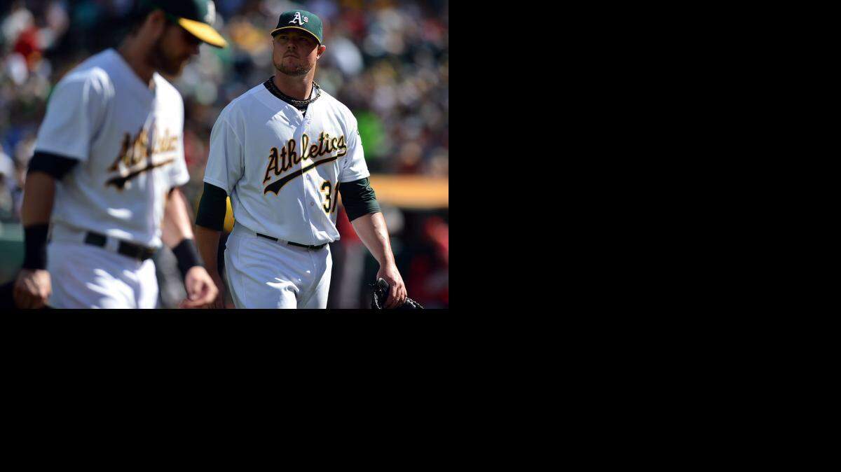 
Oakland left-hander Jon Lester, right, will start the AL wild-card game against the Royals on Tuesday night.
