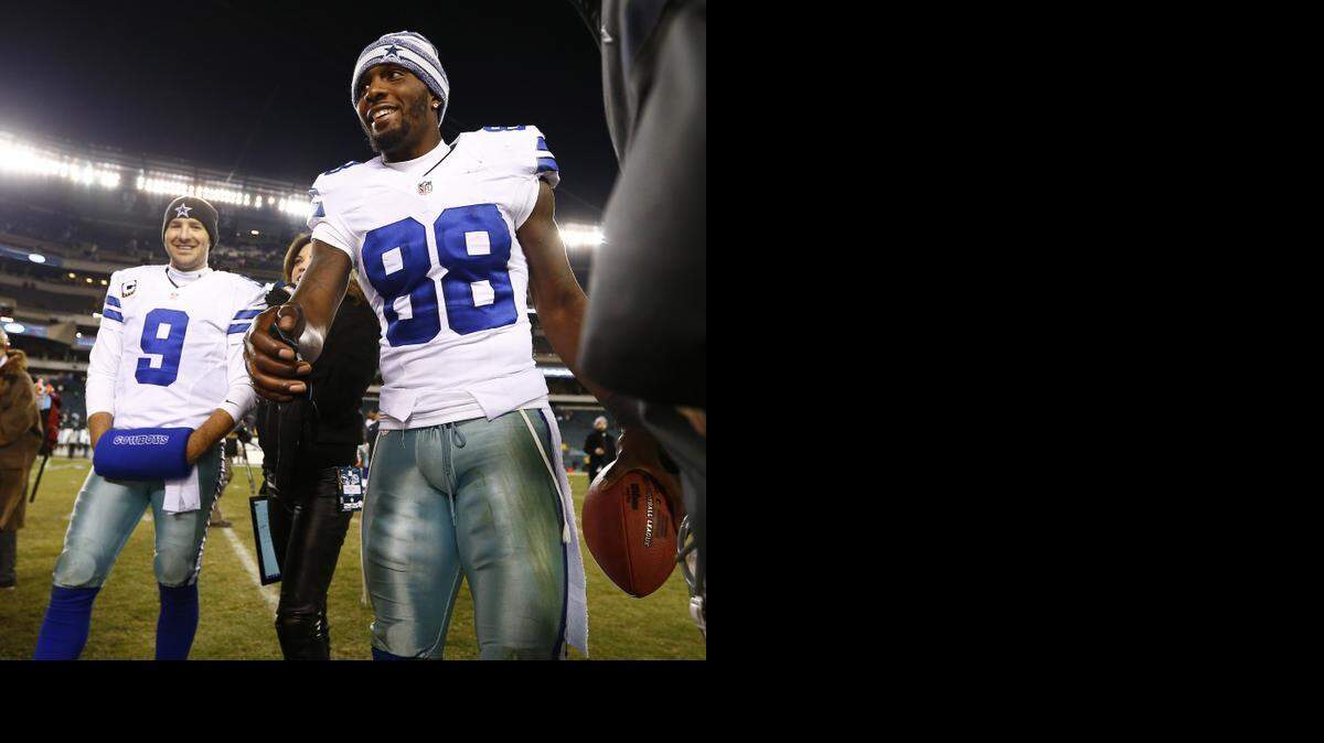 
Tony Romo, left, and Dez Bryant are all smiles after the Cowboys’ 38-27 win over Philadelphia on Sunday night.
