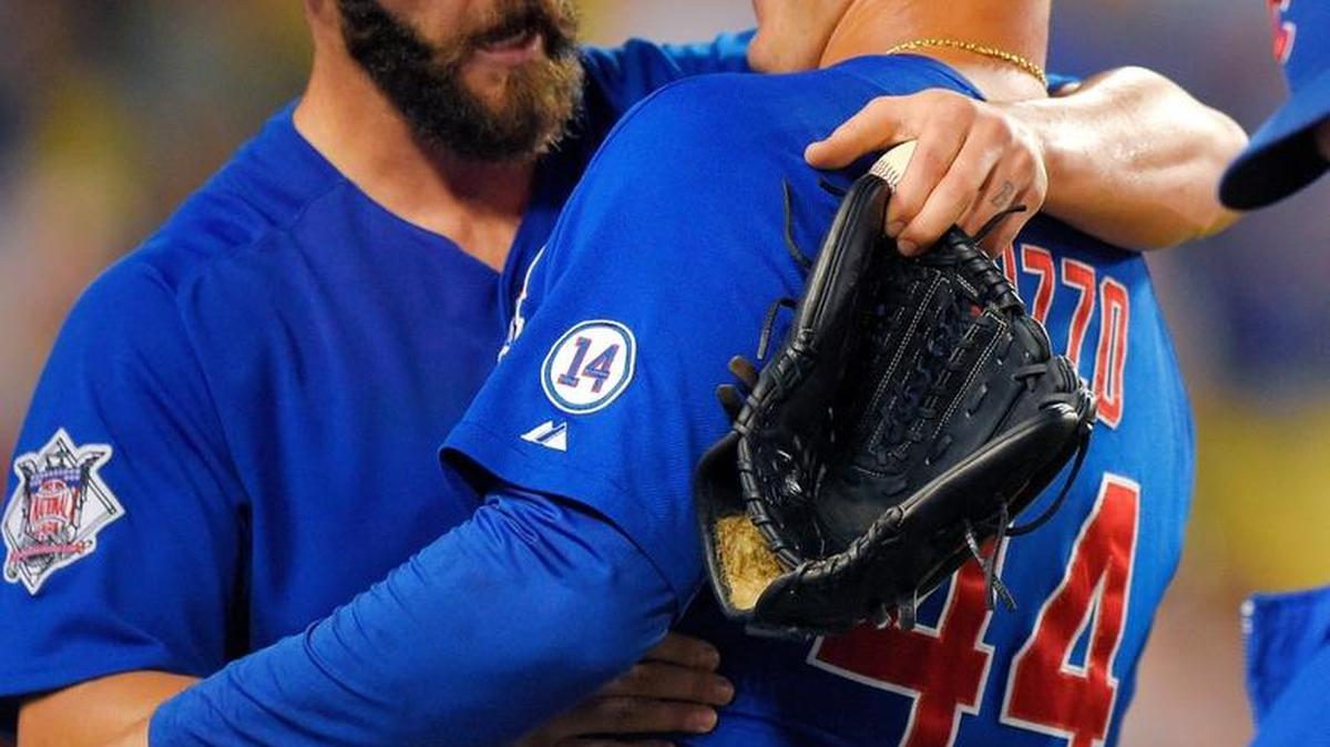 
Chicago Cubs starting pitcher Jake Arrieta, left, celebrates with teammate Anthony Rizzo after completing a no-hitter against the Los Angeles Dodgers on Sunday in Los Angeles. The Cubs won 2-0.
