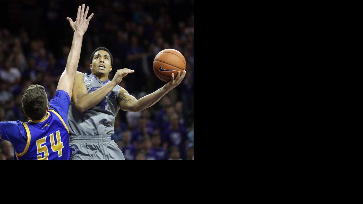 
Kansas State guard Justin Edwards, right, shoots while covered by UMKC forward Isaac Kreuer in November.

