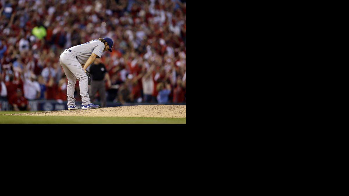 
Los Angeles Dodgers starting pitcher Clayton Kershaw pauses after giving up a three-run home run to St. Louis Cardinals' Matt Adams in the seventh inning in Game 4 of baseball's NL Division Series on Tuesday.
