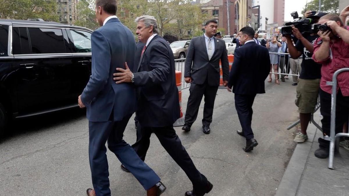 
New England Patriots quarterback Tom Brady, left, leaves Federal court Monday after settlement talks between Brady and lawyers for NFL Commissioner Roger Goodell failed, leaving a judge to decide the fate of Deflategate.

