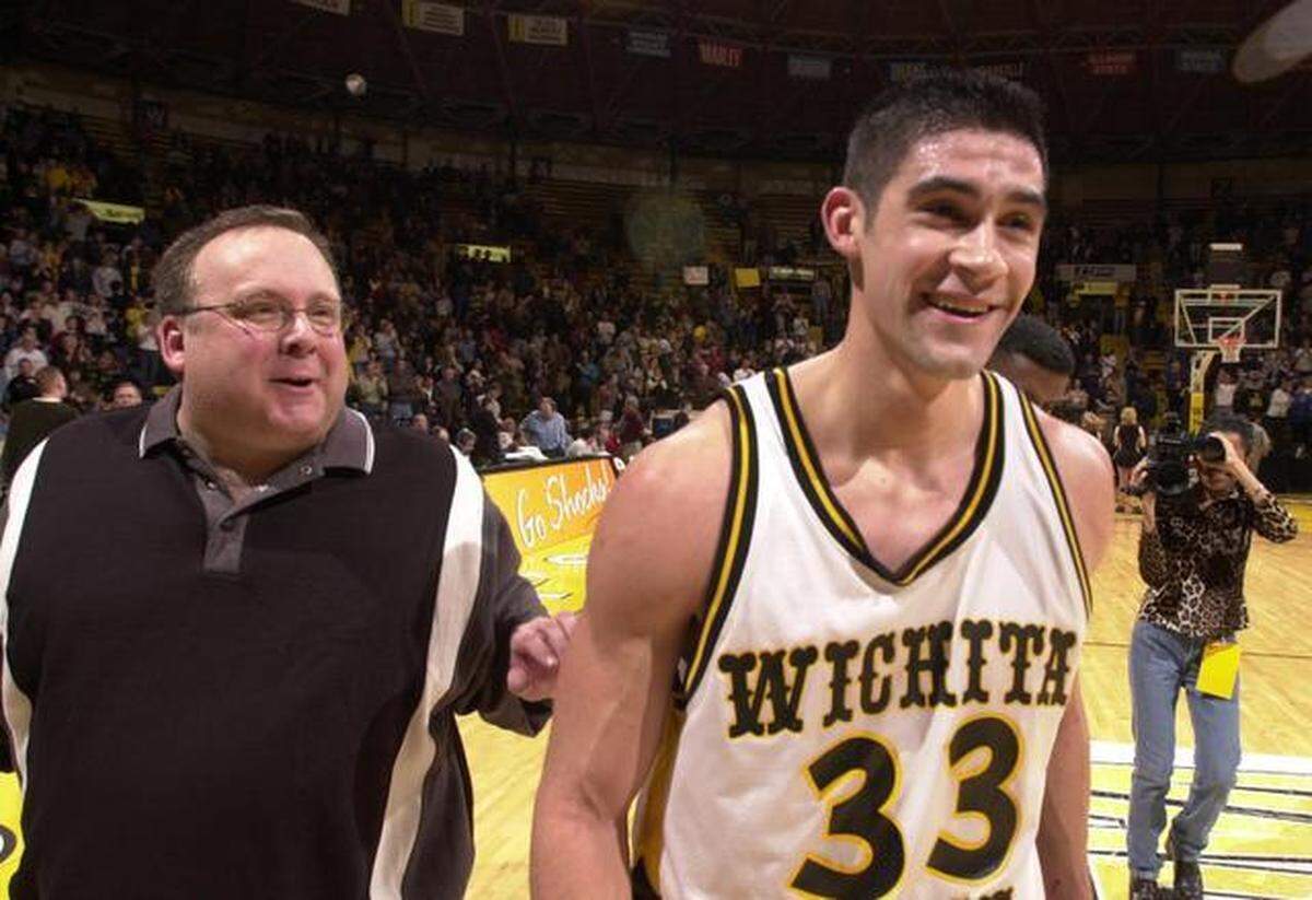 WSU assistant coach Dale Faber congratulates Jason Perez after a Wichita State victory during the 1999-2000 season.