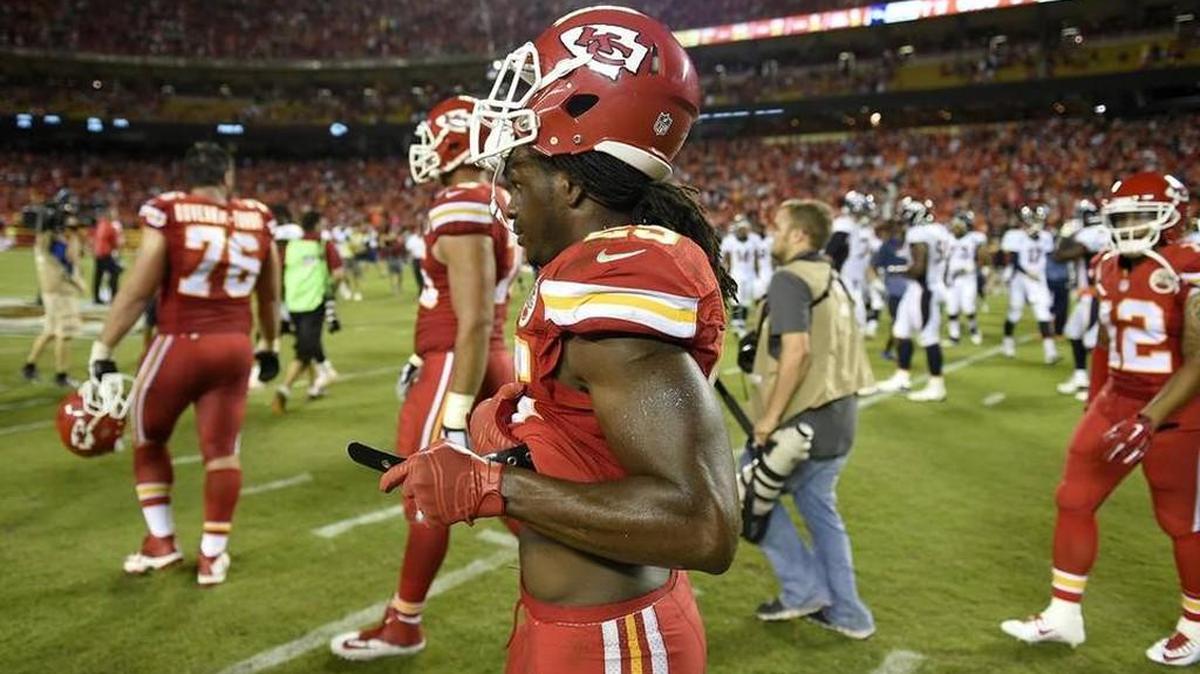 
The Chiefs’ Jamaal Charles unbuckles his shoulder pads after his late fumble cost the team dearly in a loss to the Denver Broncos at Arrowhead Stadium on Thursday night.
