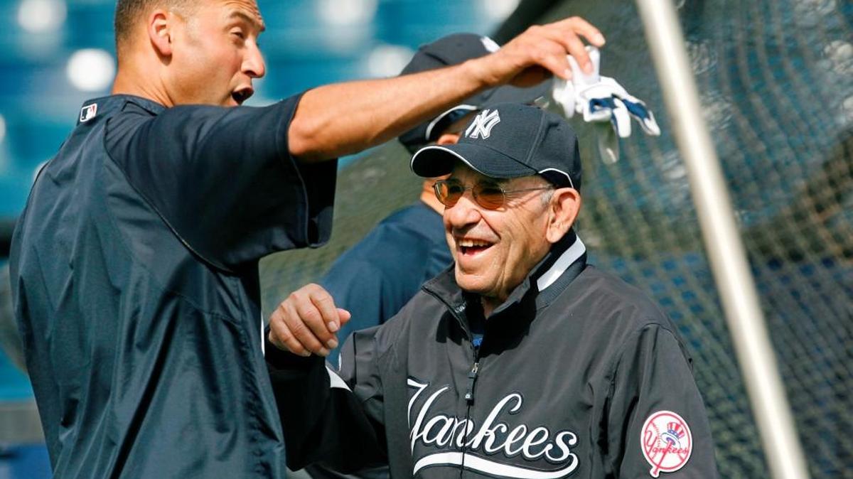 
Yogi Berra visits with former New York Yankees shortstop Derek Jeter before a spring training game in 2008.
