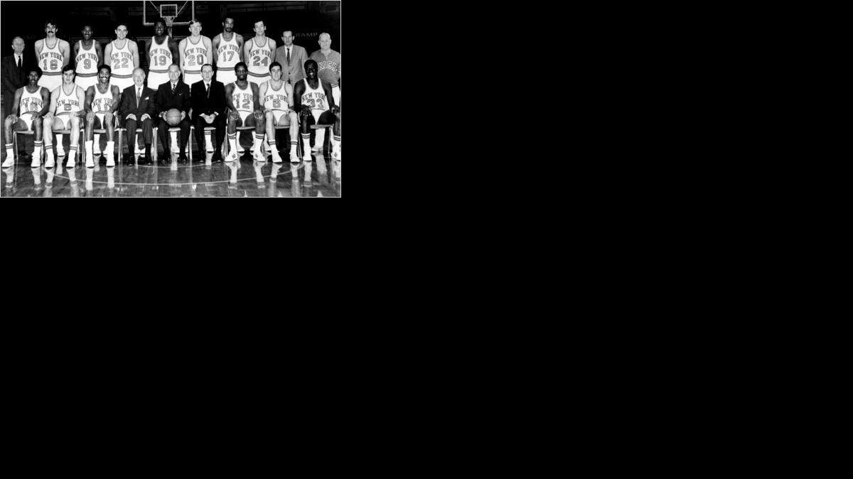 
The 1969-70 NBA champion New York Knicks: Standing, left to right: Coach Red Holzman, Phil Jackson, Dave Stallworth, Dave DeBusschere, Willis Reed, Bill Hosket, Nate Bowman, Bill Bradley, scout Dick McGuire, trainer Dan Whelan. Seated, left to right: John Warren, Don May, Walt Frazier, president Ned Irish, chairman of board Irving Mitchell, general manager Ed Donovan, Dick Barnett, Mike Riordan, Cazzie Russell.
