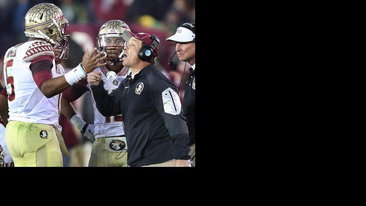 
Florida State coach Jimbo Fisher, right, converses with quarterback Jameis Winston (5) during the Rose Bowl College Football Semifinal game against Oregon on Thursday.
