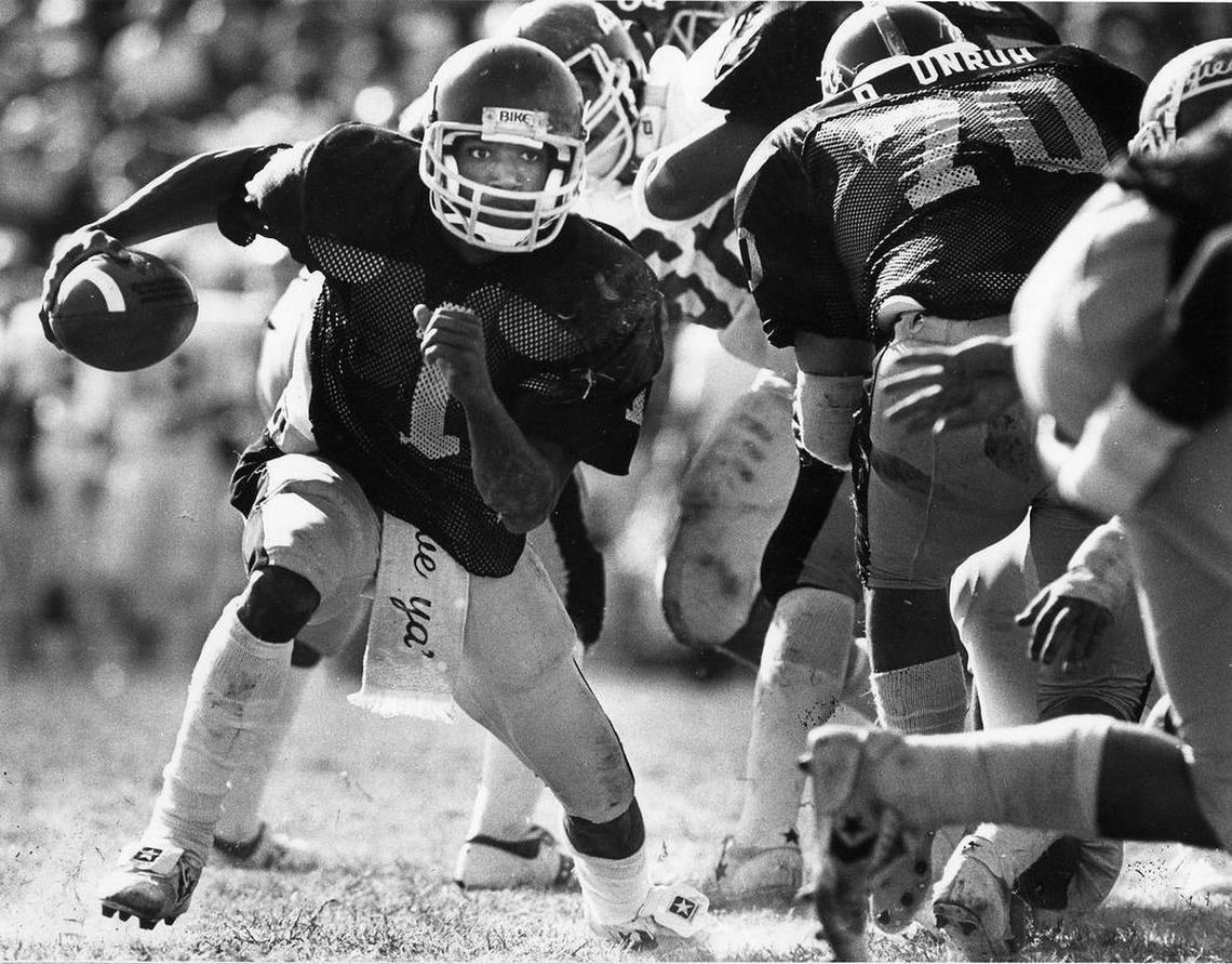 Wichita State quarterback Prince McJunkins, one of the most successful players in WSU football history, runs an outside option play against New Mexico State on Oct. 16, 1982. The game was played at Cessna Stadium.