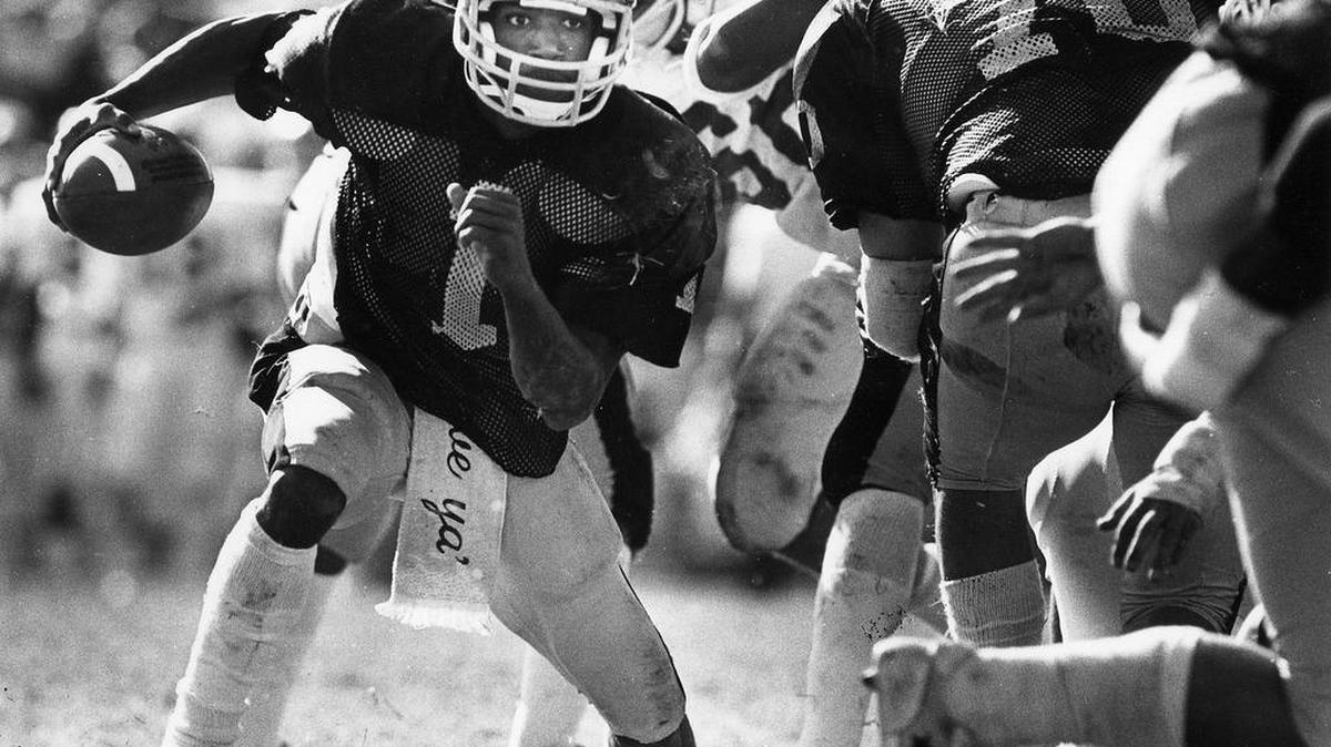 Wichita State quarterback Prince McJunkins, one of the most successful players in WSU football history, runs an outside option play against New Mexico State on Oct. 16, 1982. The game was played at Cessna Stadium.