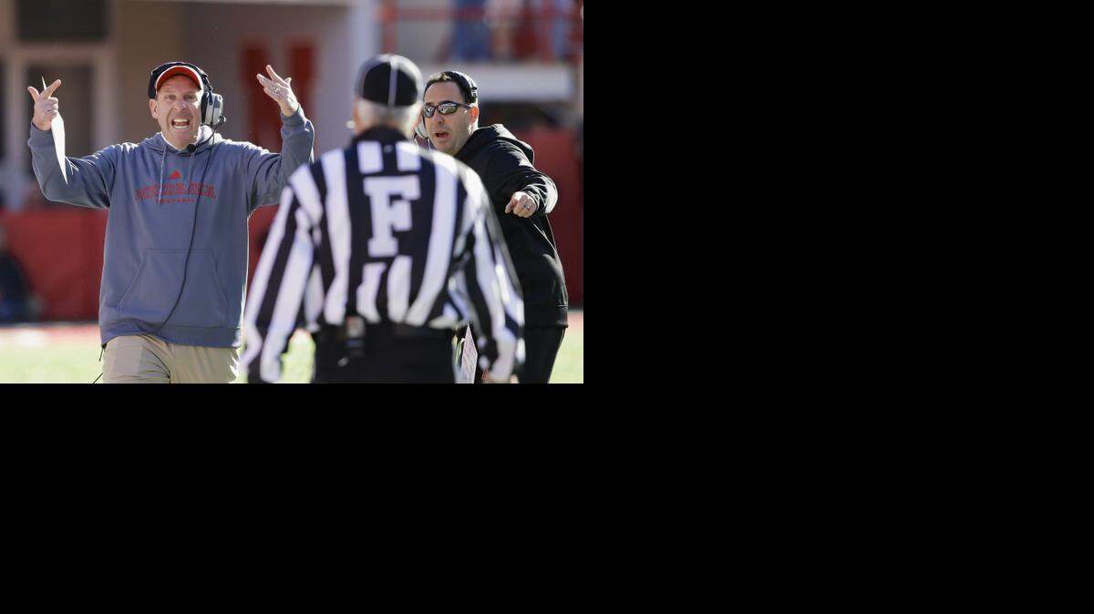 
Nebraska head coach Bo Pelini, left, disputes a call against the Huskers during a game against Purdue on Nov. 1. The always-emotional Pelini was fired Sunday.
