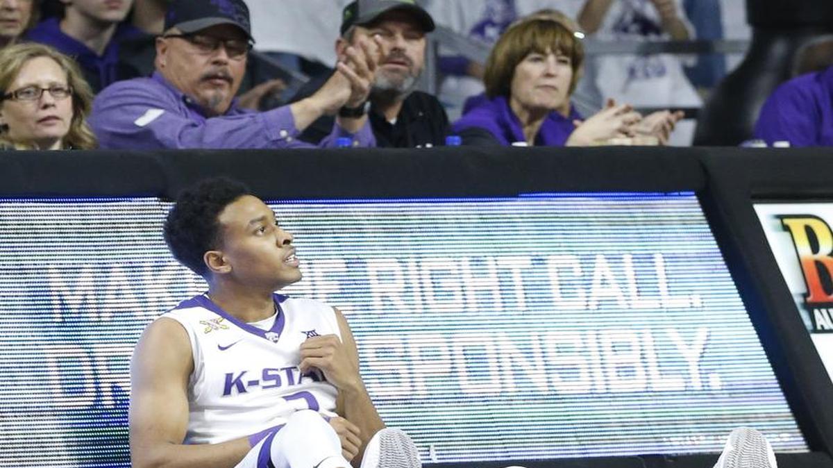 K-State guard Kamau Stokes (3) rests on the floor after shooting a 3 point shot against Oklahoma State Saturday night in Bramlage Coliseum(January 23, 2016)
