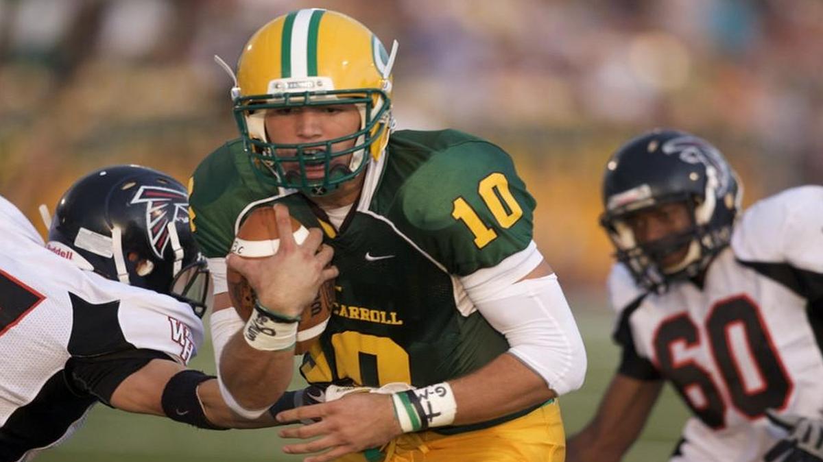 HIGH SCHOOL FOOTBALL: Bishop Carroll's quarterback Blake Bell runs in for a touchdown in the first quarter against Heights in Friday's season opening football game at Bishop Carroll. (Photo by Kelly Glasscock/Correspondent) Photographer: Kelly Glasscock