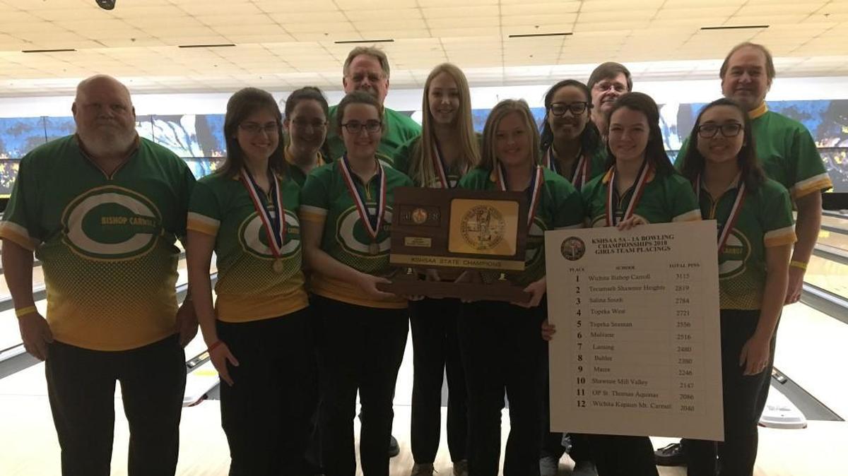 Bishop Carroll bowling team poses with team trophy after winning Class 5-1A girls title Friday at Northrock Lanes.