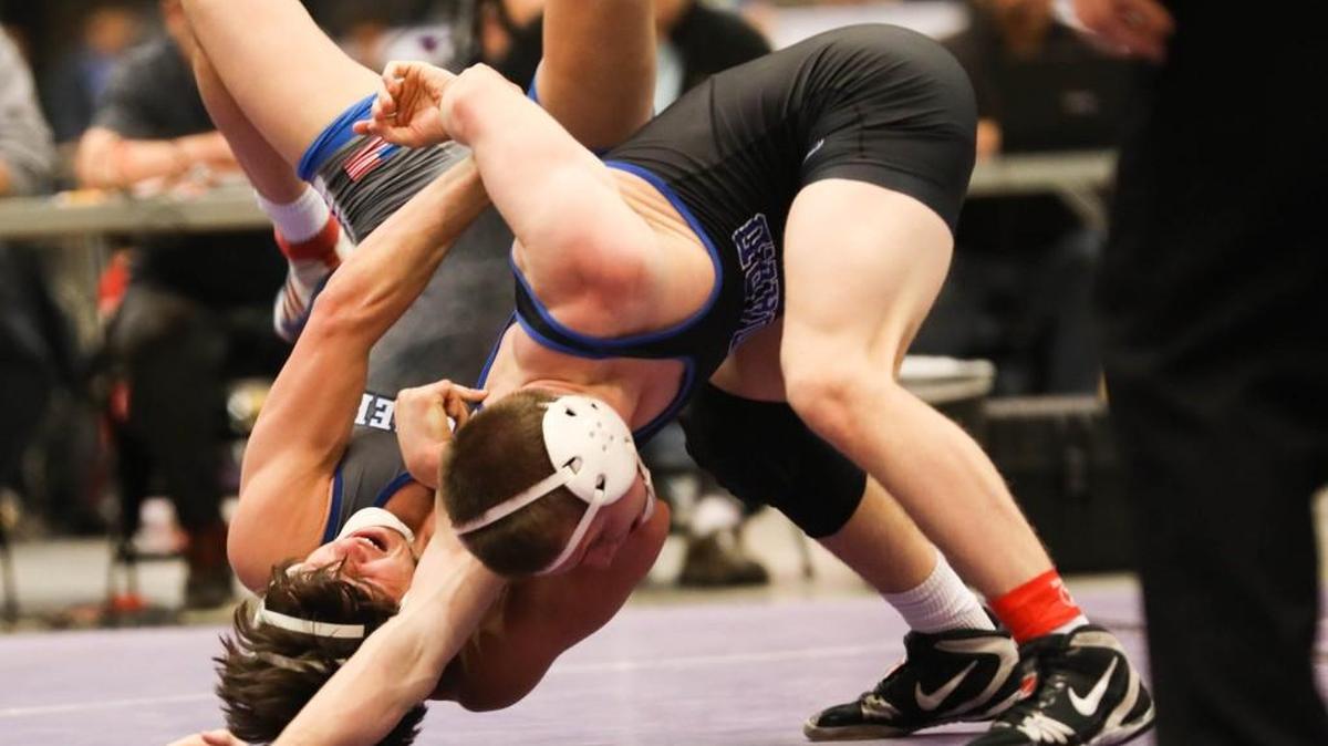 Goddard’s Garrett Lange, front, flips Andover’s Paul Stuart during last year’s Class 5A meet at Hartman Arena.