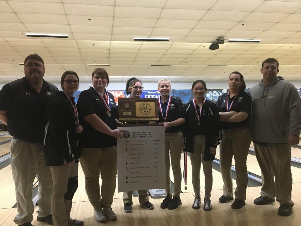 Campus girls bowling team and individual champion Piper Reams, second from left, stand with Class 6A championship trophy.