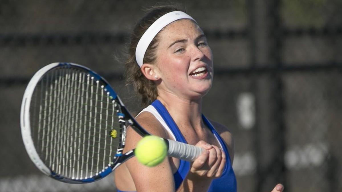 Kapaun freshman Clara Whittaker practices with her team Wednesday. She's already won singles titles at the City League meet and a Class 5A regional. The state tournament is Friday and Saturday at Maize South.