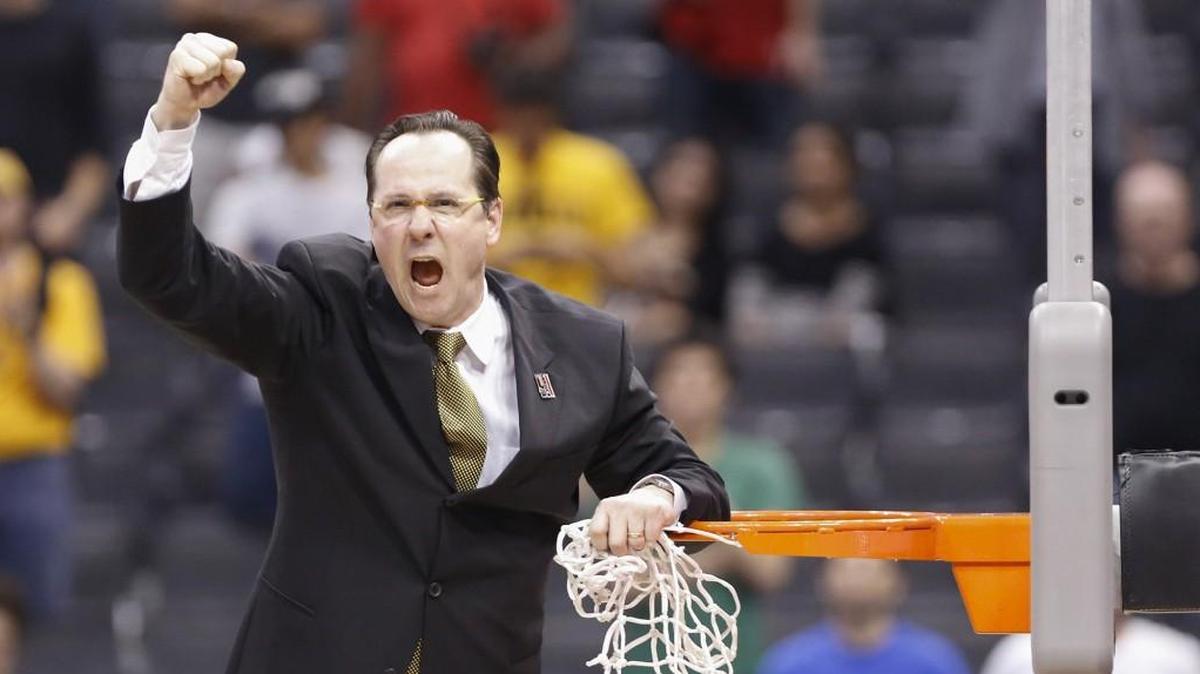Wichita State coach Gregg Marshall yells at the crowd after cutting down the net following a victory in the West Regional Final in Los Angeles in 2013. The win put WSU into the Final Four.