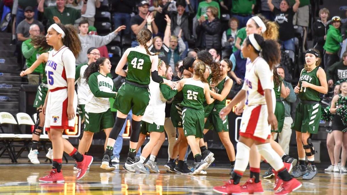 Derby players celebrate after hitting the game-winning shot in the final seconds of Friday’s Class 6A girls semifinals at Koch Arena.