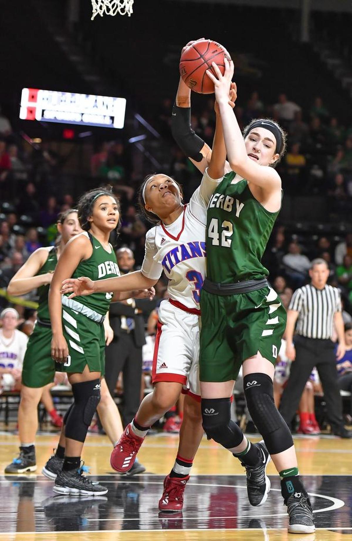 Derby's Kennedy Brown, right, and South's Tre’Zure Jobe fight for a rebound during a Class 6A girls semifinal at Koch Arena.