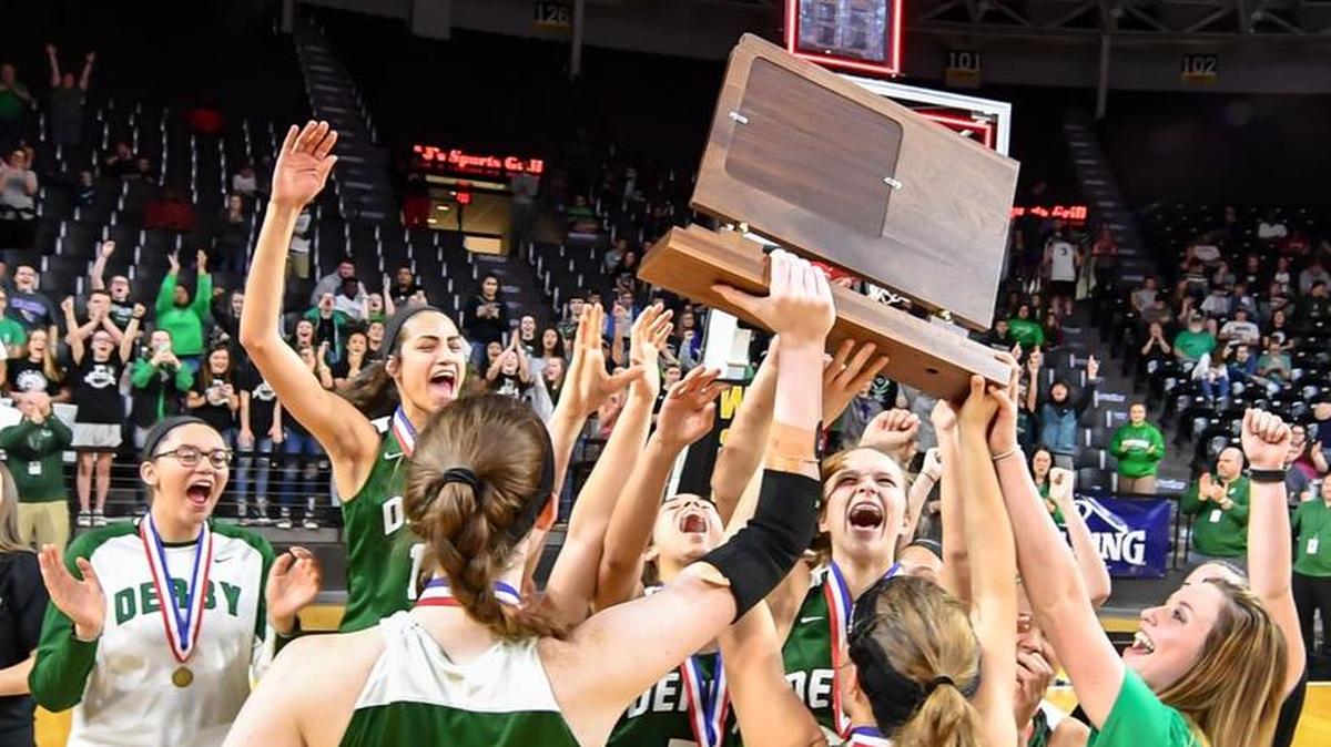Derby players celebrate after winning the Class 6A championship at Koch Arena.