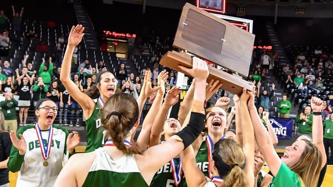 Derby players celebrate after winning the Class 6A championship at Koch Arena.