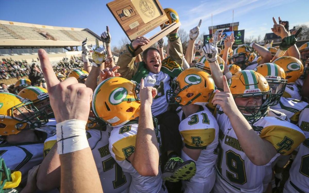Bishop Carroll celebrates another state title after defeating St. Thomas Aquinas 38-28 to win the 5A state title Saturday in Pittsburg.