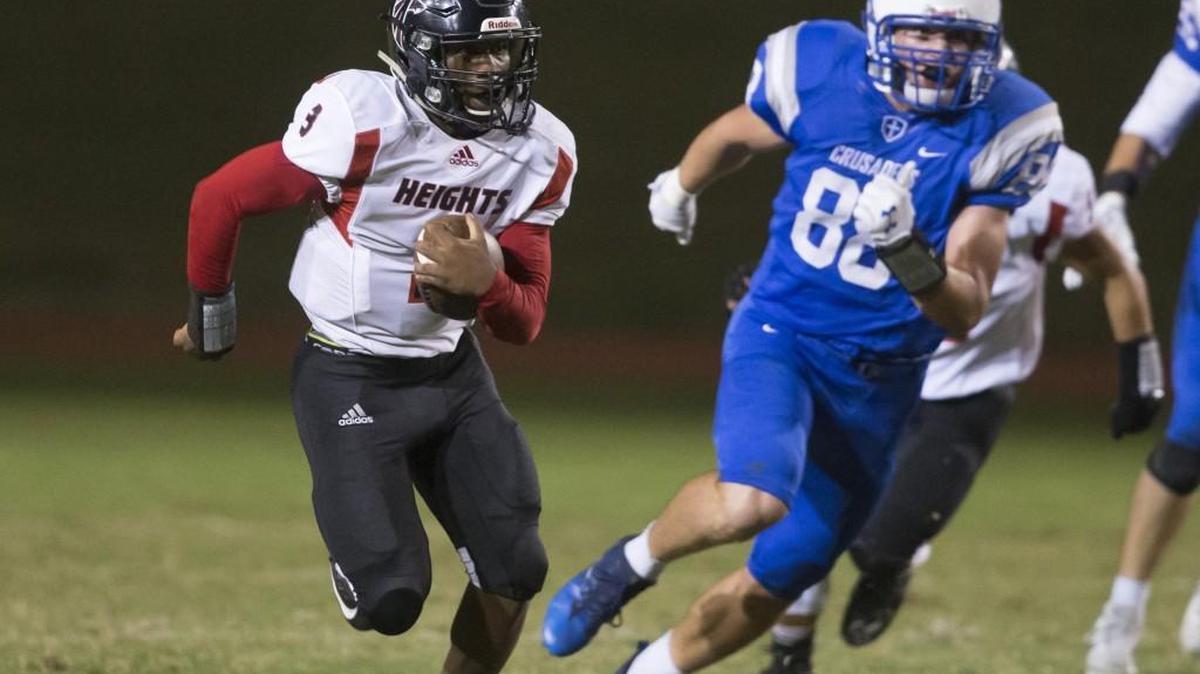 Heights quarterback K’Vonte Baker runs for a first down earlier this season.