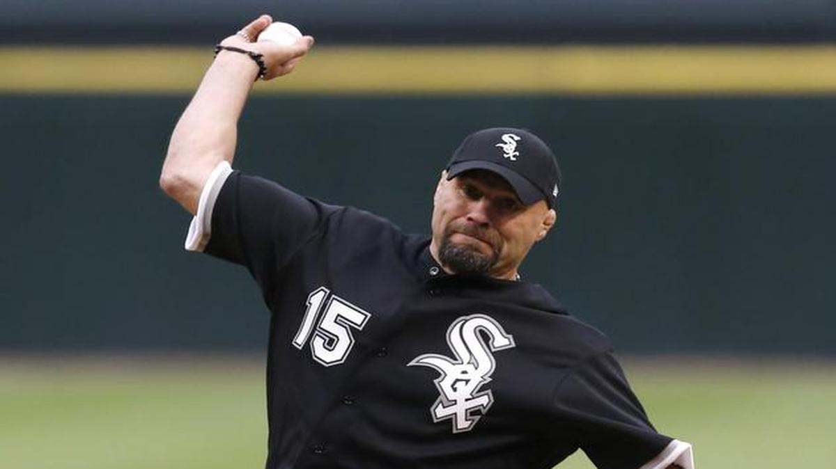 
 Six-time mixed martial arts champion Randy Couture throws out a ceremonial first before a game between the White Sox and the Tigers on May 5 in Chicago. Couture, now retired from fighting, is finding time to do things for himself. 

