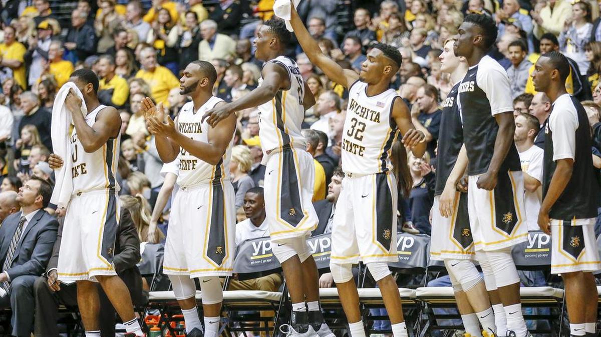The Wichita State bench erupts as Anton Grady hits another shot against Evansville in the second half at Koch Arena Wednesday. (jan 6, 2016)