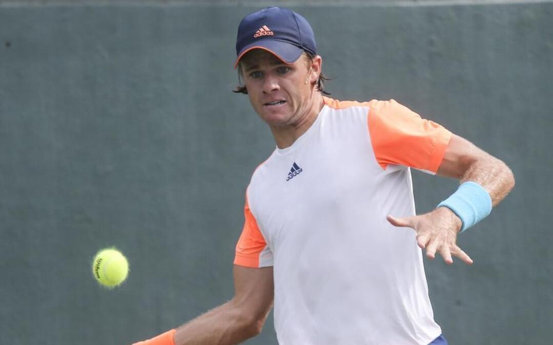 Christian Harrison returns a shot during Saturday’s semifnals of the Wichita Tennis Open at the Coleman Tennis Complex. Harrison won the championship on Sunday.